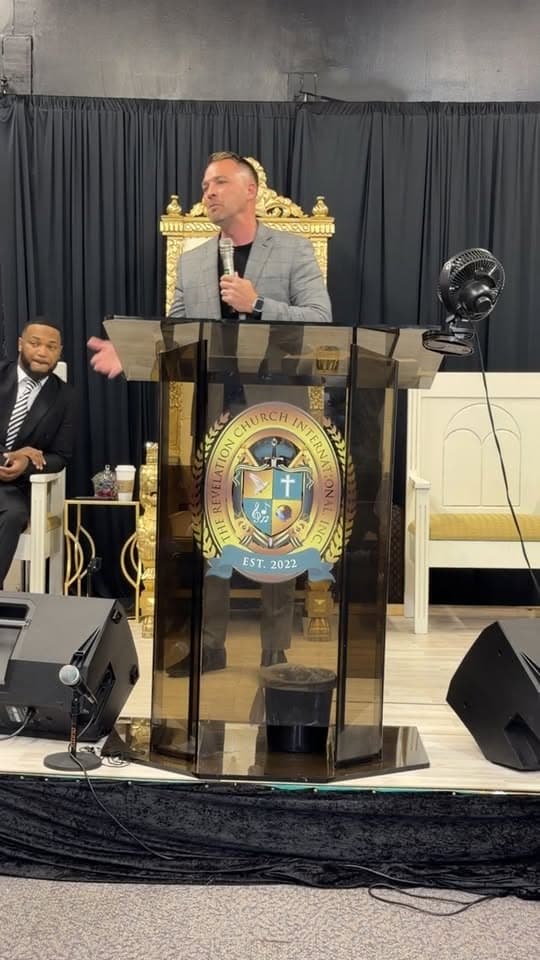 Guest minister preaching at Revelation Church